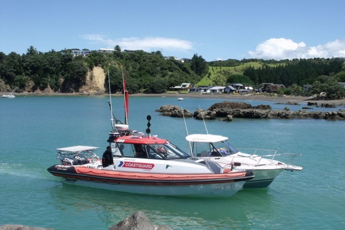 Coastguard towing a boat.
