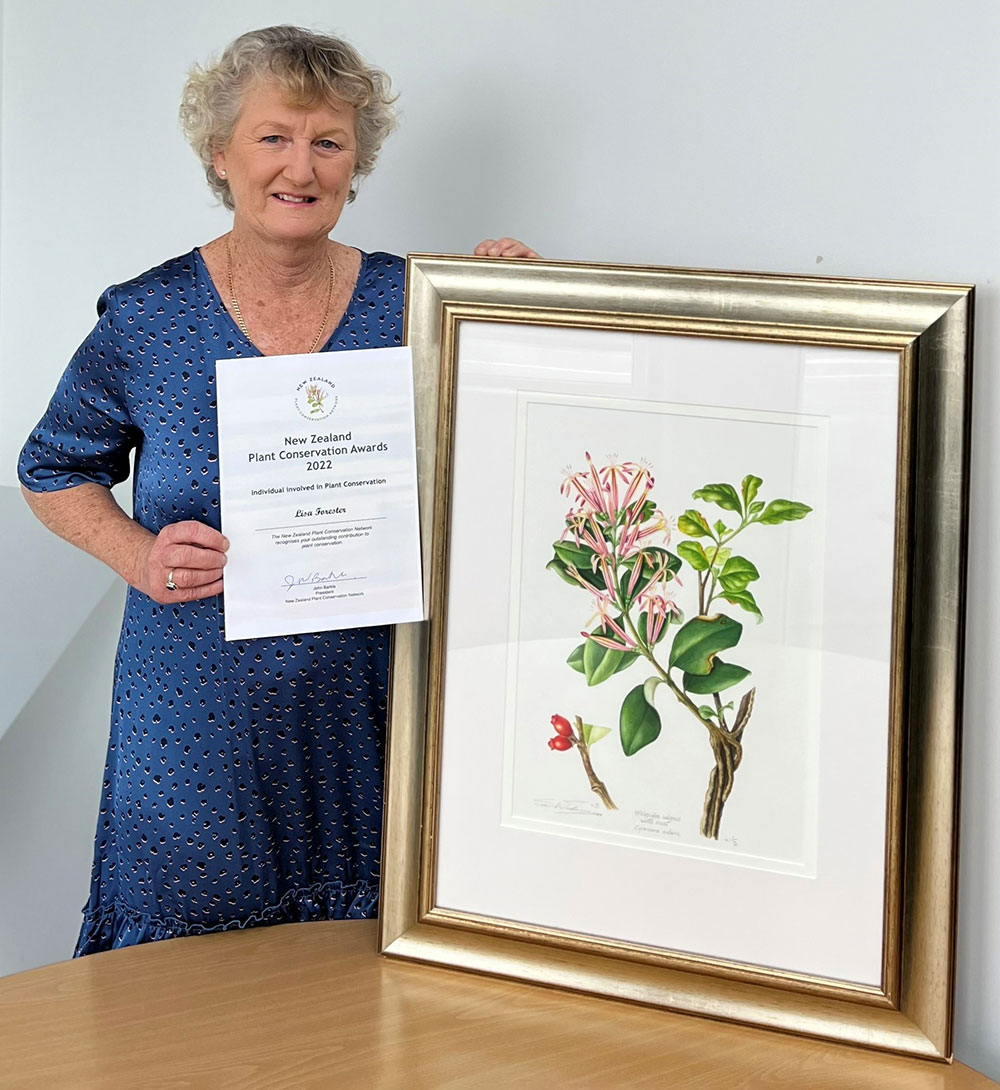 Lisa Forester with certificate and painting.