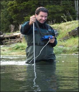 Gauging water in the Opouteke River.