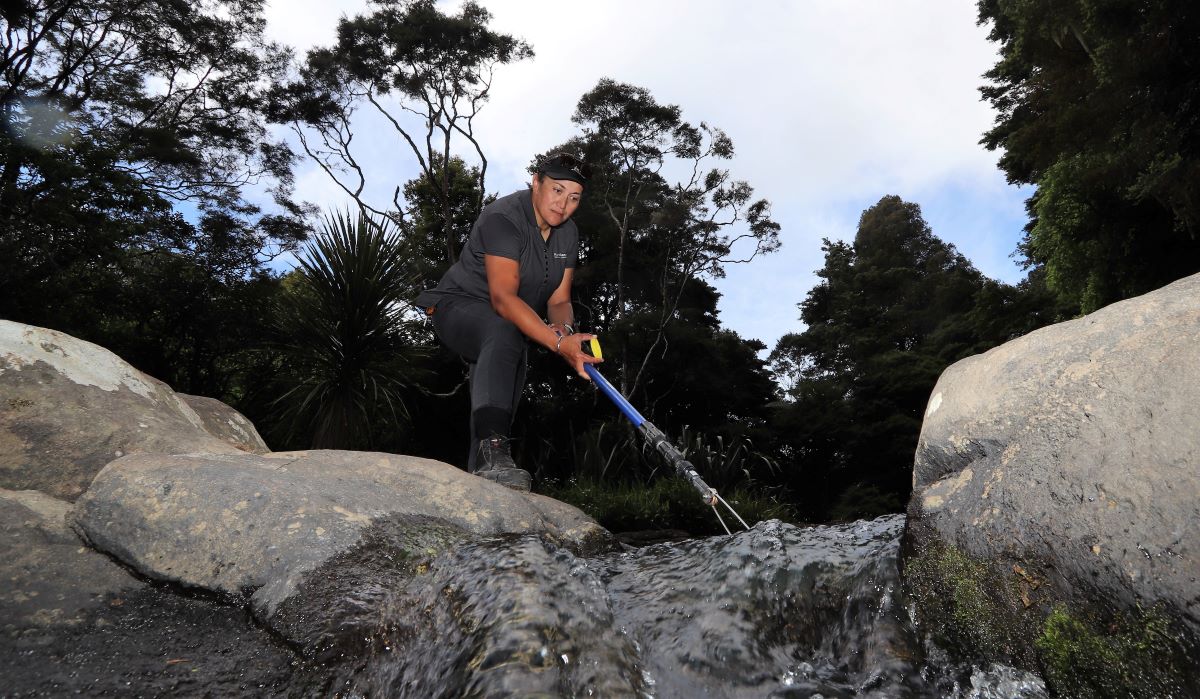 Lyndell McGregor, Environmental Monitoring Officer - Mid North, takes a sample in the Kerikeri area at one of the new places that will be sampled as part of the regional council’s annual summer swim spot water quality testing programme.