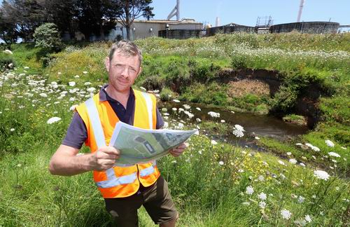 River Management Engineer Barney Brotherhood surveys eroding stopbanks behind Juken New Zealand’s Kaitaia triboard mill.