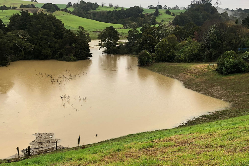 Whangārei’s Hopua te Nihotetea water detention dam full of water.