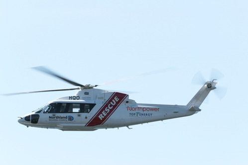 NEST rescue helicopter in the air.