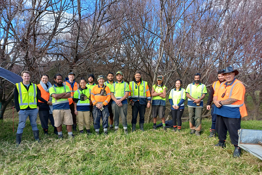 A group of men and women wearing hi-vis.