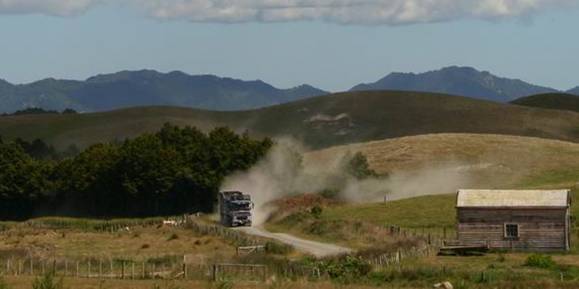 Cattle truck on a metal road.