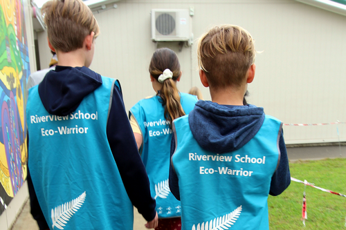 School children wearing eco-warrior vests.