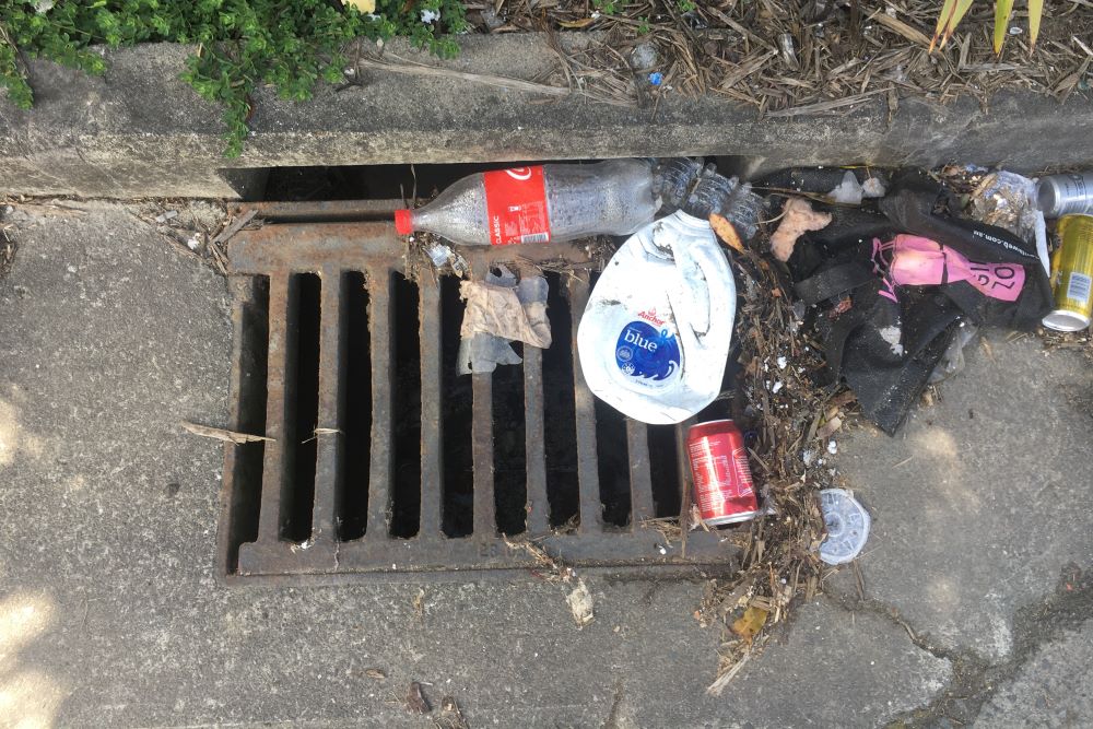 Litter on a stormwater grate.