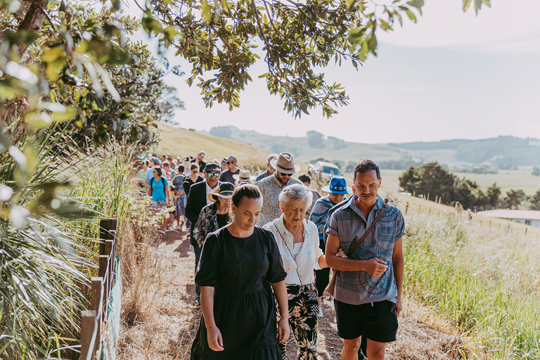 Kaiya Lafotanoa with Clare Stensness and NRC Councillor Peter Lucas Jones leading the hikoi up the hill