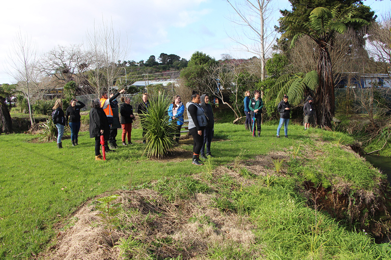 Wai Restoration tour participants take a look at the awa restoration project