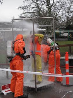 Regional Council staff being decontaminated.