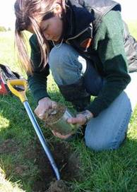 NRC staff member taking soil sample.