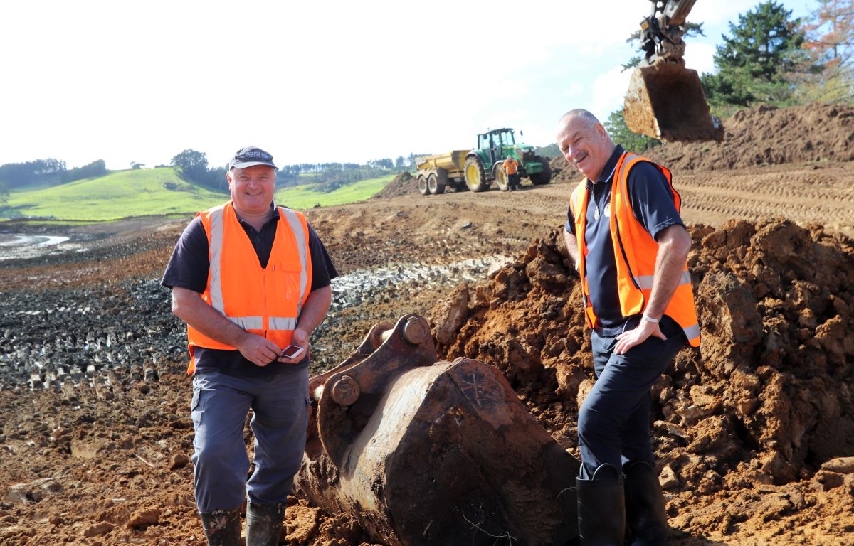 Regional council Kaitaia Area Manager Peter Wiessing, left, and Cr Colin ‘Toss’ Kitchen check progress during previous upgrades to the Awanui flood scheme in mid-June this year.  A third upgrade construction season – expected to see roughly $3m of new works over the next several months – has just begin.
