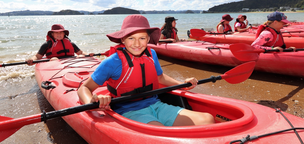 School students in kayaks.