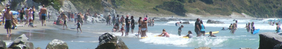 People swimming at Mangawhai.