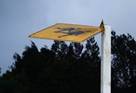 Sign blown over by the wind.