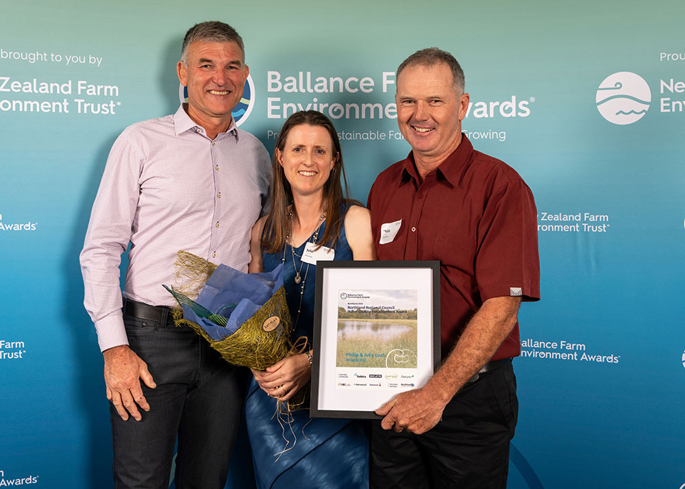 Winners with flowers and certificate.