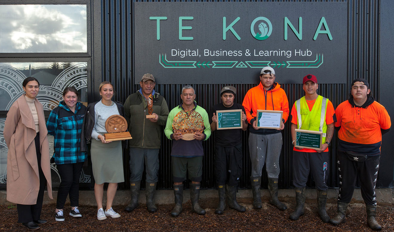 Te Kotahitanga e Mahi Kaha Trust team members with awards.