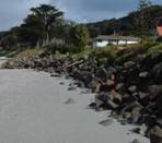 Example of coastal protection works (seawall) resulting from coastal development in a hazard zone at Rangiputa.