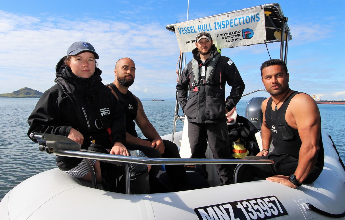 Hull inspection contract team on their boat.
