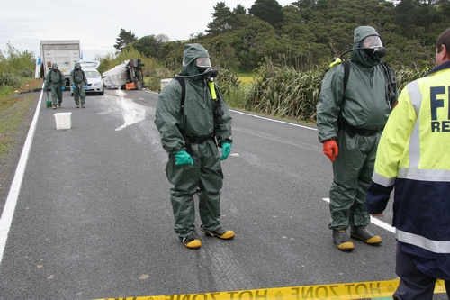 Sulphuric acid spill on road.