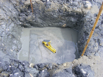 Description: Installation of a concrete sediment plate in Kerikeri Inlet. 