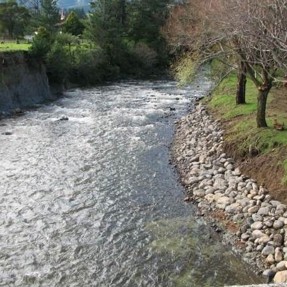 River with rocks supporting riverbank.