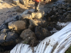 Beach rock wall construction close-up. 