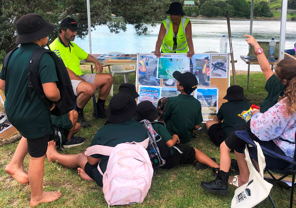 Group of children learning about protecting beaches.