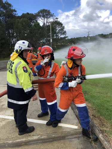 YES participants with fire hose.