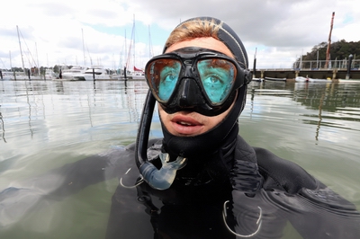 A diver in the water at Opua.