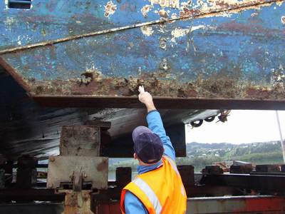 Collecting marine samples from a fouled hull.