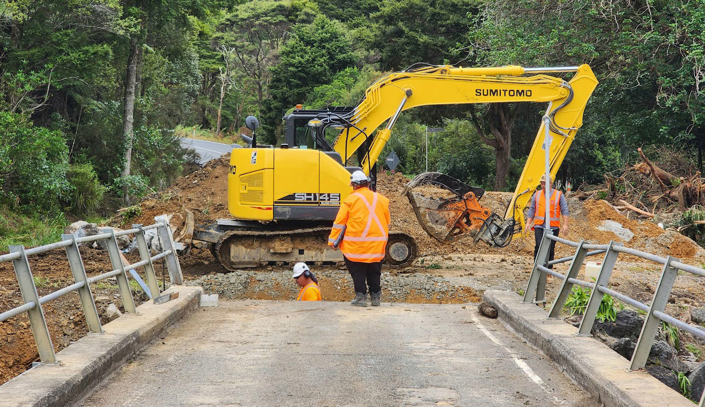 Contractors and machinery at bridge repair.