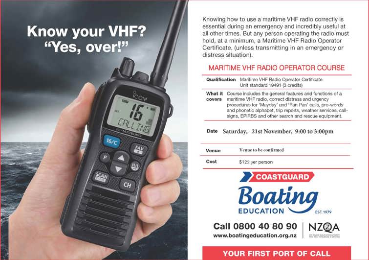 Hand holding a maritime VHF radio.