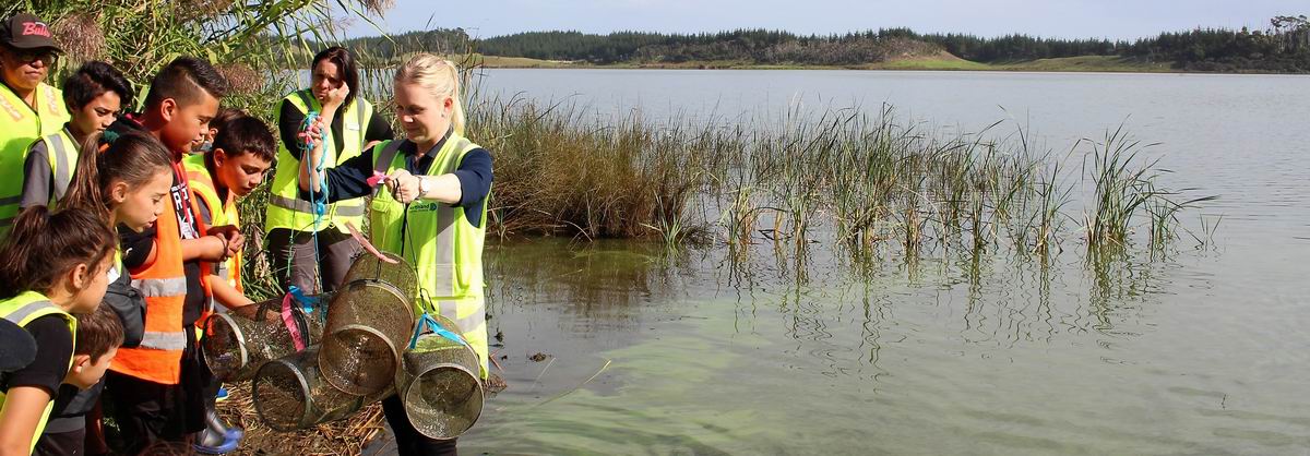 Inspecting fish traps at the lake.