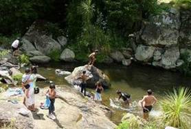 Children swimming in a river.