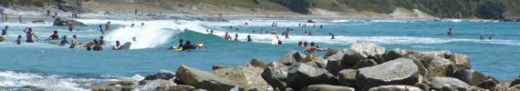 People in water at Mangawhai.