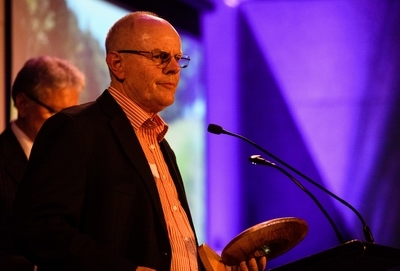 Chairman Bill Shepherd holding the award.