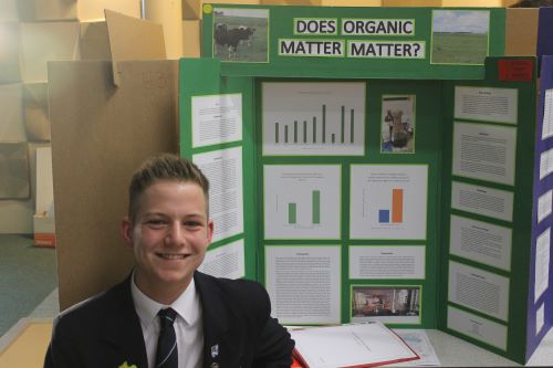 Jonty Kirk stands in front of his award winning science project.