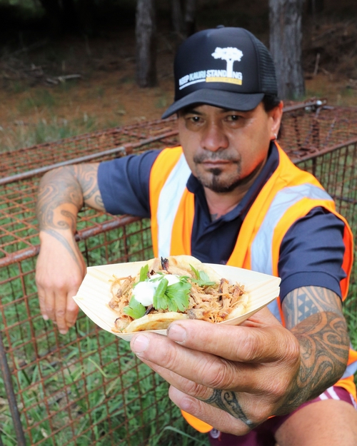 Warren Morunga holding a wild pork roll.