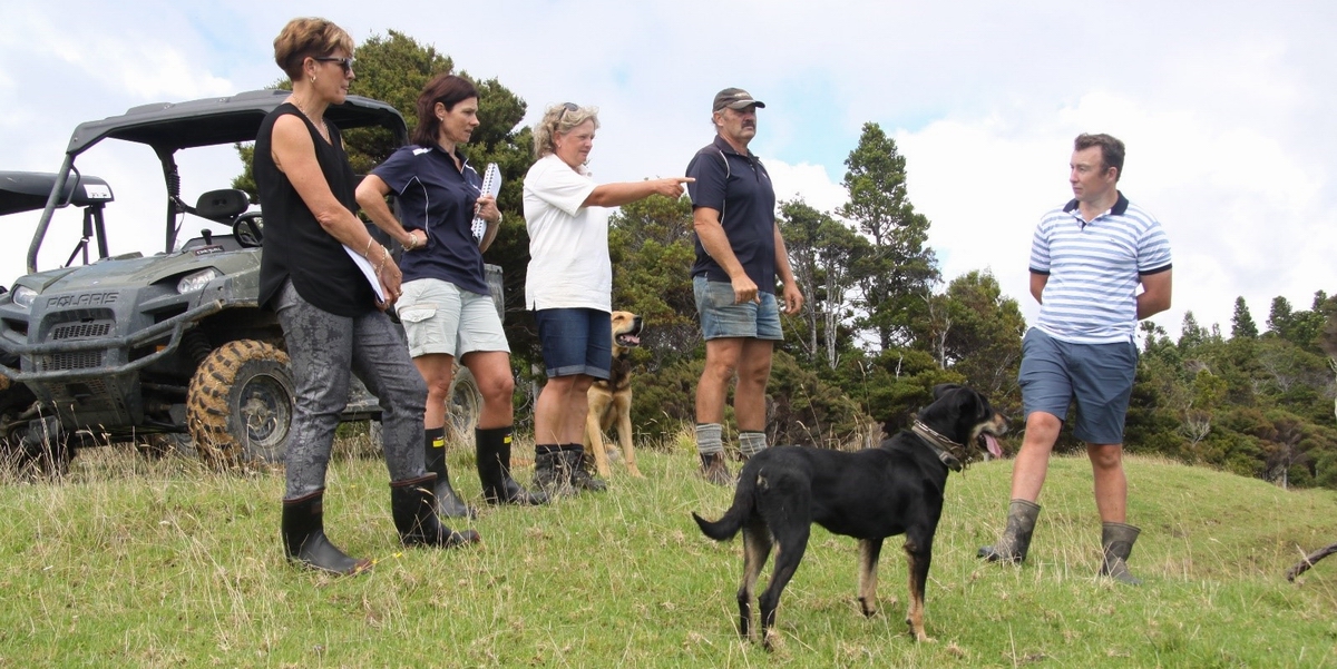 Greta and Craig Harman (3rd and 4th from the left) showing people around their farm in Whananaki.