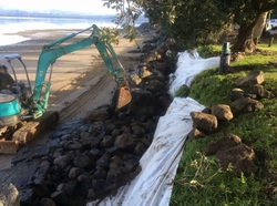 Beach rock wall construction.