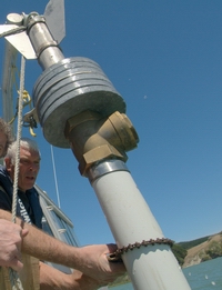 Description: Gravity corer being deployed to collect sediment cores. 