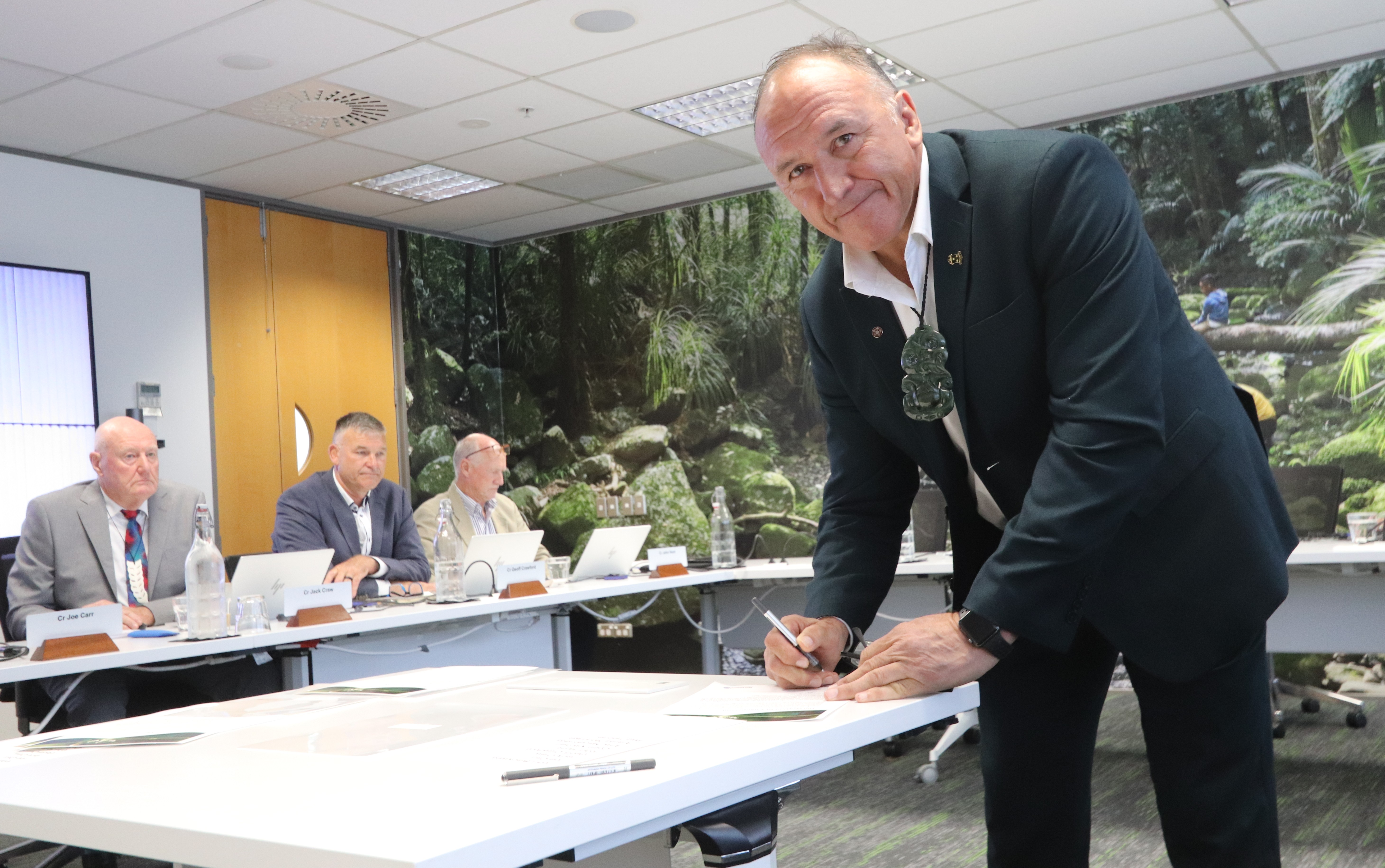 Pictured Chair Pita Tipene signing the official declaration.
