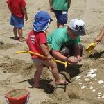 Children building sand castles.