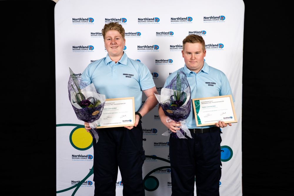 Award recipients with certificates.