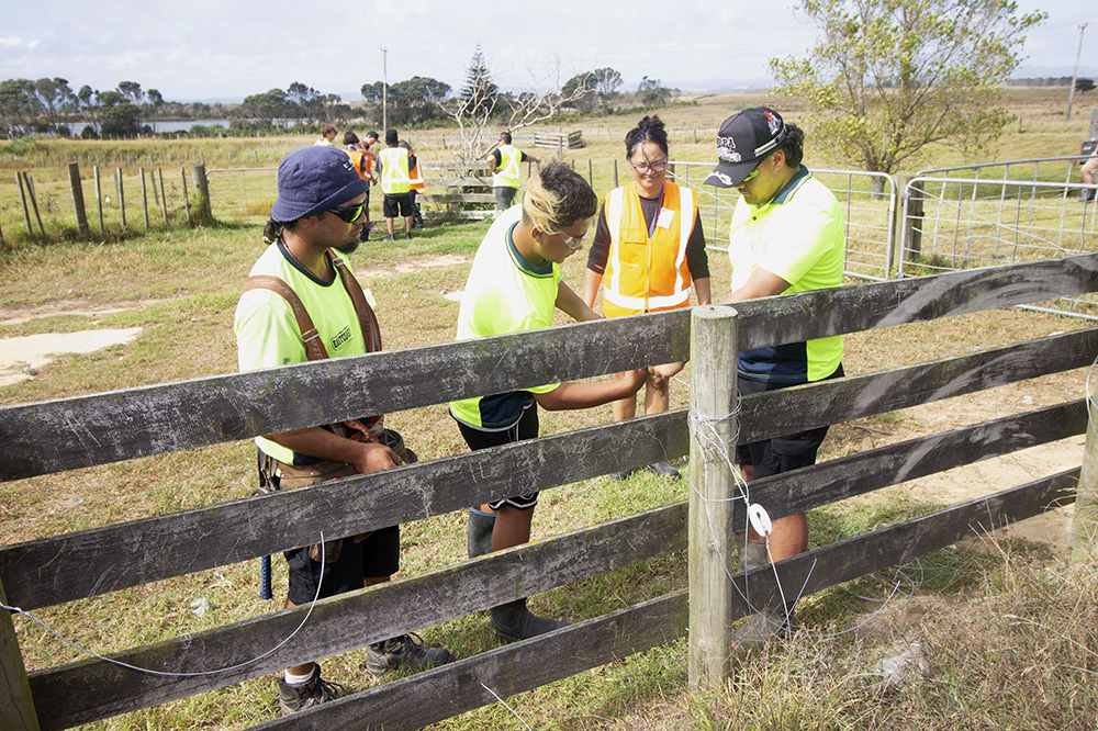 Students working on a rail fence.