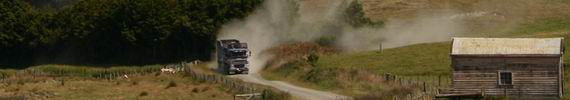 Cattle truck on a metal road.