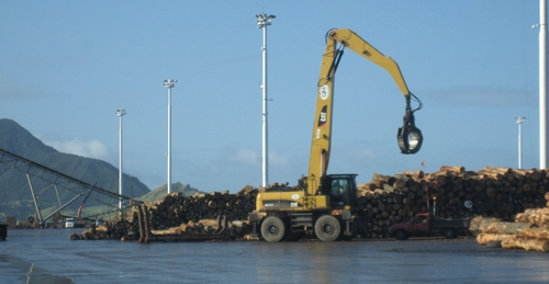 Digger moving logs at Northport. 